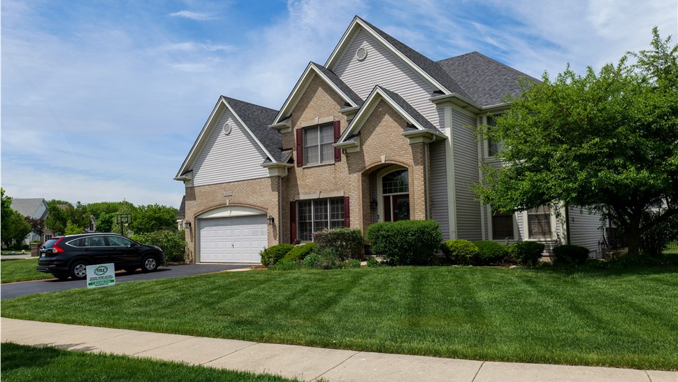 "Roof showcasing Owens Corner Peppercorn Shingles, exhibiting their contemporary allure and outstanding resilience."