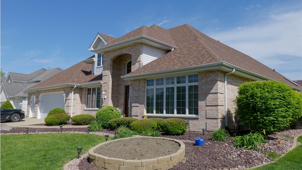 "Exquisite Owens Corner Desert Rose Shingles installed by TTLC Inc. on a stunning roof in Orland Park, IL."