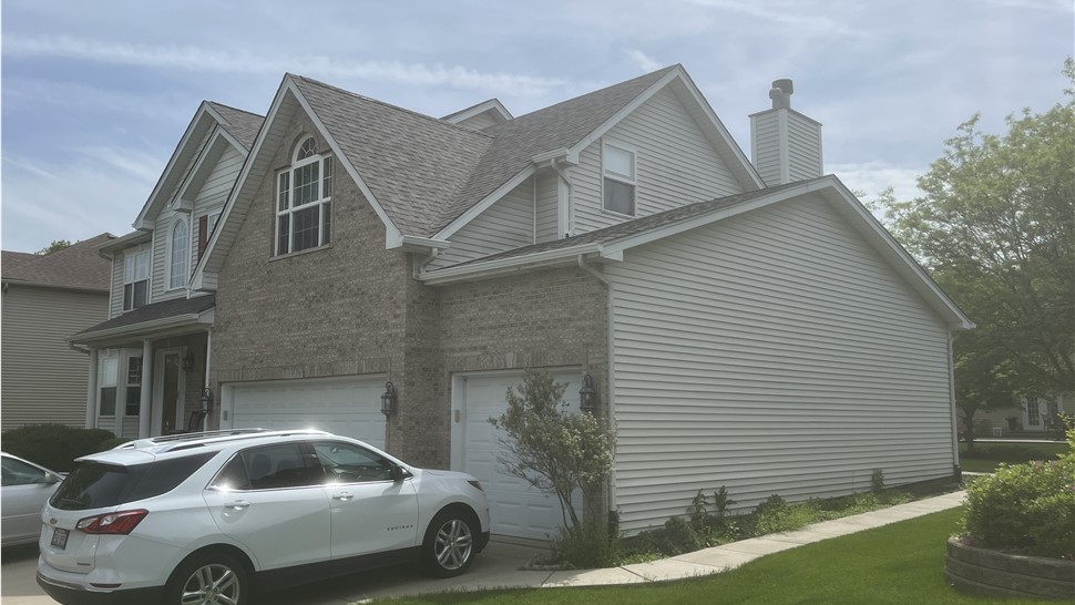 Roof with Owens Corner Driftwood Shingles, showcasing their rustic beauty and long-lasting performance."