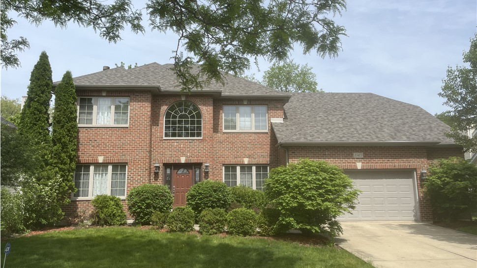 Roof with Owens Corner Driftwood Shingles, displaying their rustic beauty and lasting performance."