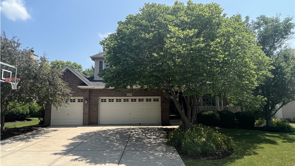 Captivating Roofing Renovation: Side Yard and Garage Radiate Elegance with Black Sable Shingles by Owens Corning - TTLC, Inc. in Shorewood, IL, Showcasing Unmatched Beauty and Durability.
