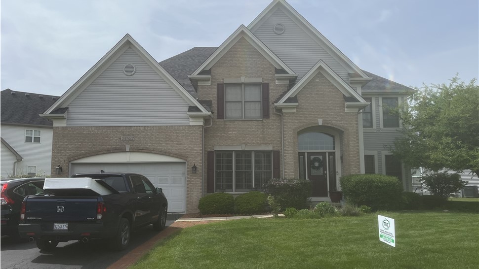 "Roof showcasing Owens Corner Williamsburg Grey Shingles, combining timeless elegance and exceptional durability."