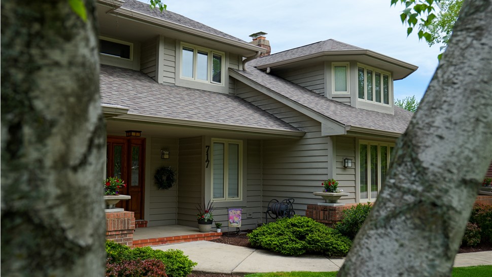 Roof covered with Owens Corner Driftwood Shingles, showcasing their durable and aesthetically pleasing design