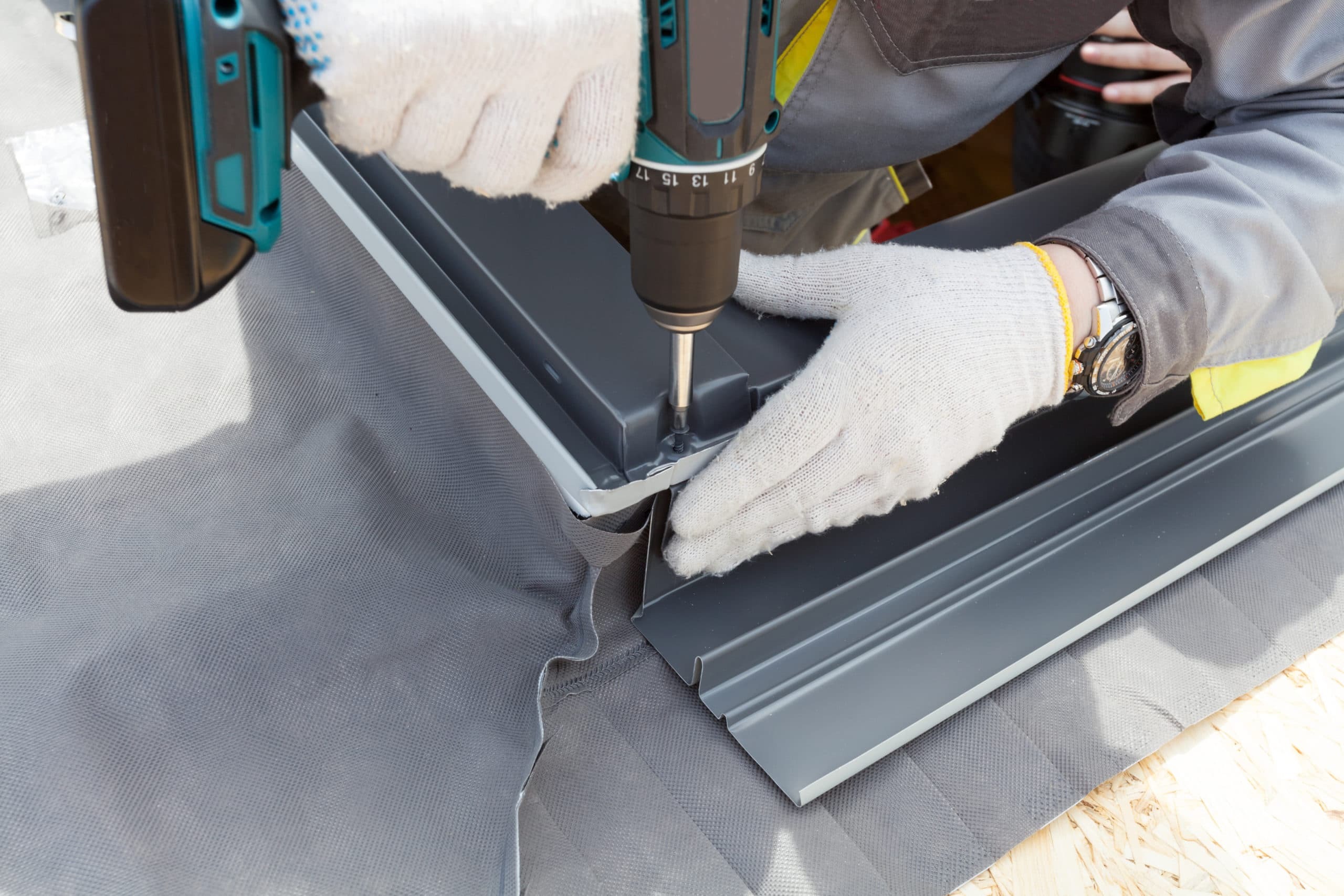 roofing professional attaching flashing for skylight installation