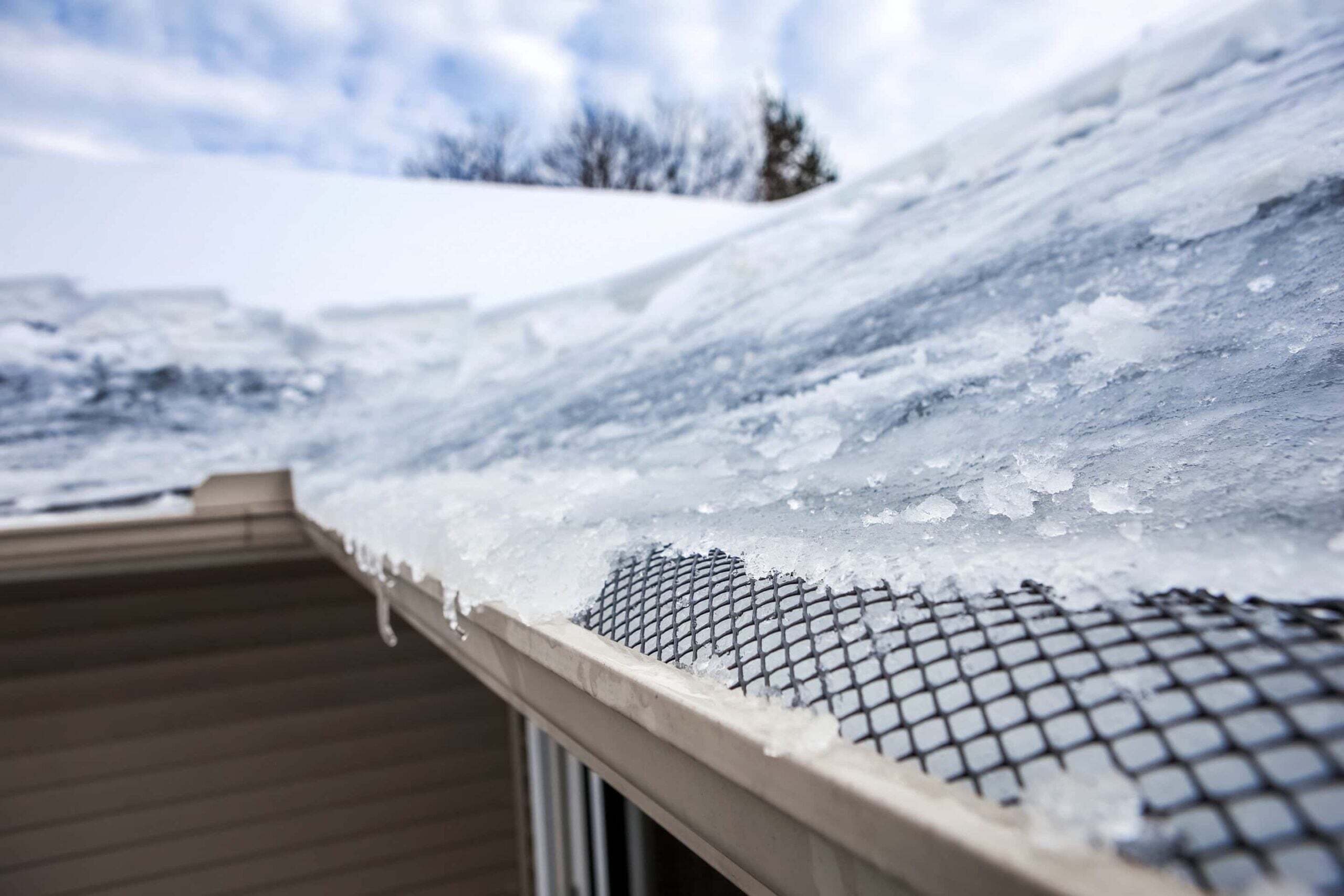 ice dam forming on roof and in gutters