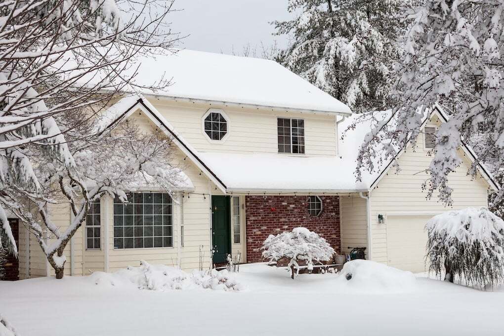 residential home after snow storm: james hardie siding installation