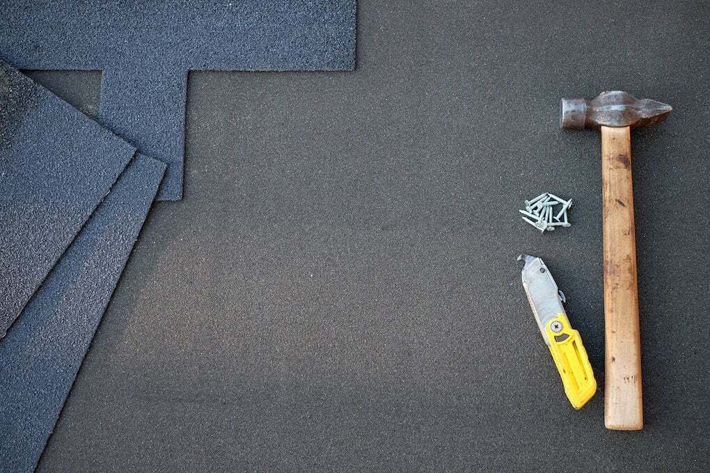 roofing tools on asphalt roof