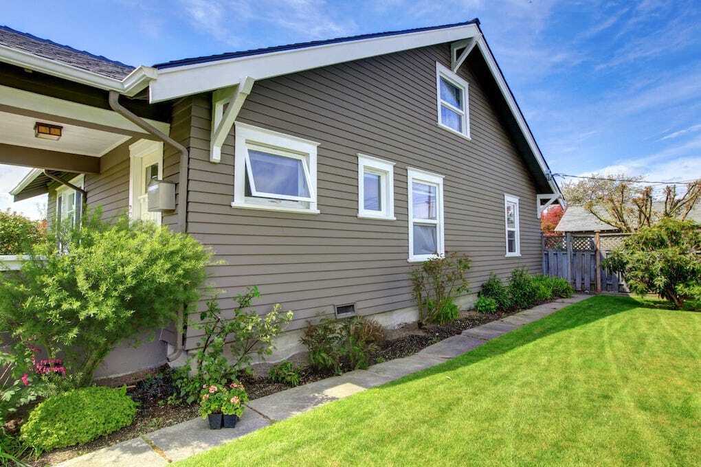 angled view of beige home after james hardie siding installation