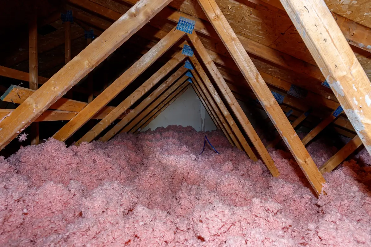 freshly installed blown-in loose fiberglass insulation