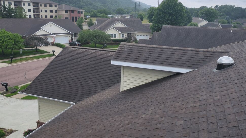 Neighborhood Roofline Inspection | First American Roofing & Siding Inc Overview of multiple residential rooflines in a neighborhood