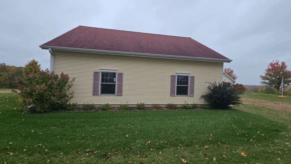 Side elevation showing two windows, yellow siding, and red roof with timestamp