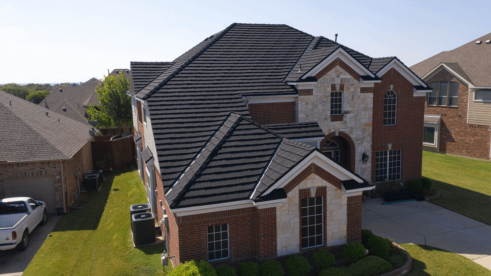 Side angle of home with Hurricane Shake Pro roof | US Metal Roofing Consortium Angled side view of house showcasing Hurricane Shake Pro metal roofing by US Metal Roofing Consortium.