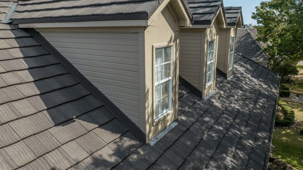 Dormer Detail on Metal Shake Roof | US Metal Roofing Consortium Close view of dark metal shake roof with dormer windows