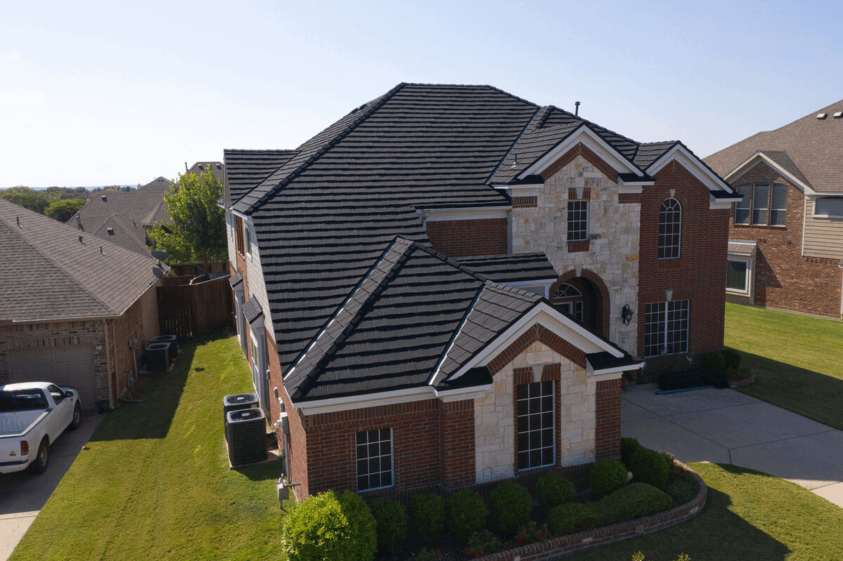 Angled side view of house showcasing Hurricane Shake Pro metal roofing by US Metal Roofing Consortium.