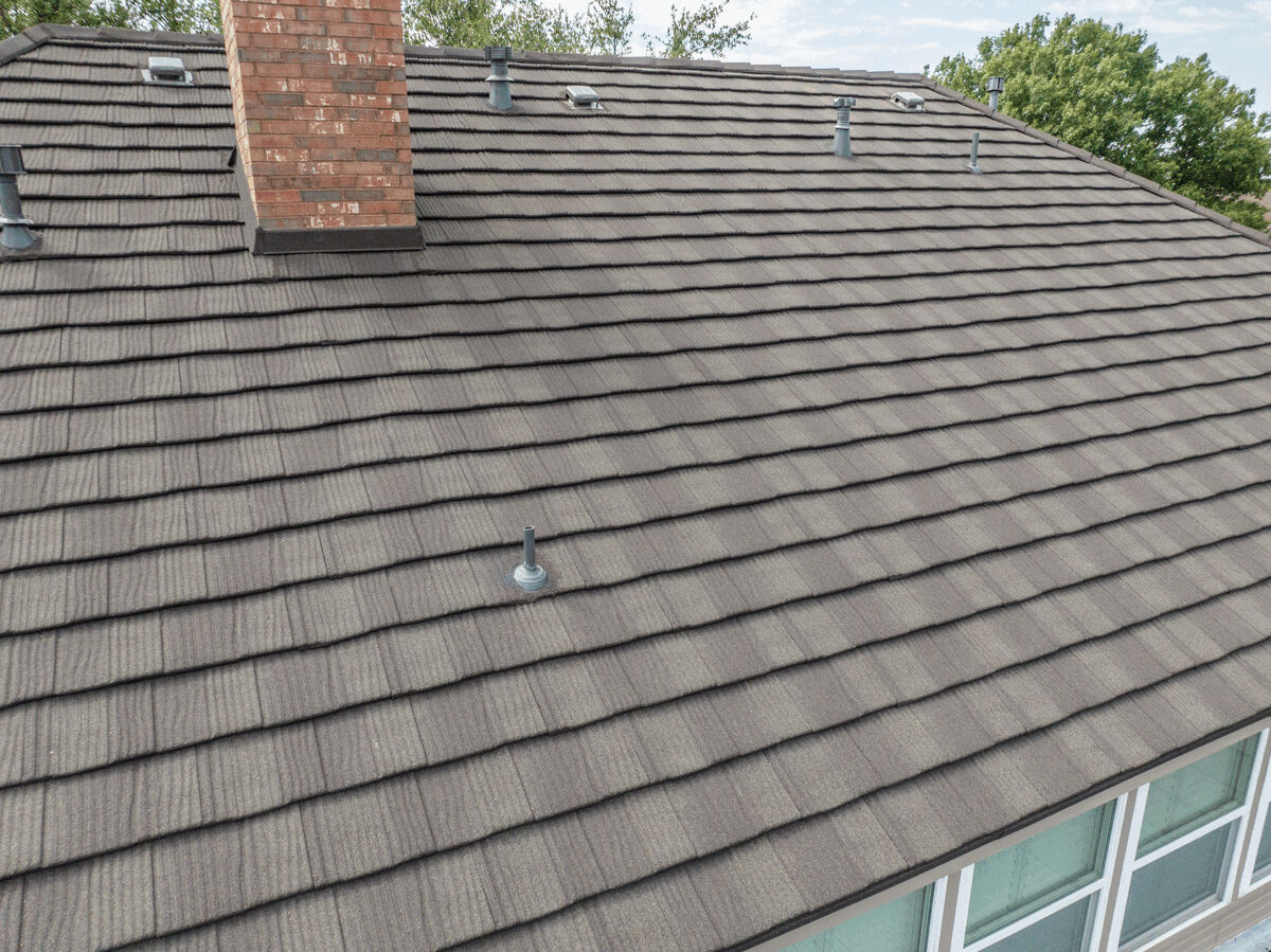 Aerial view of metal shake roof with chimney and roof vents
