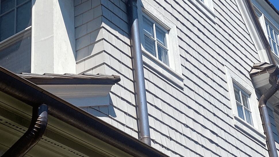 Eave Gutter and Soffit Detail | C&N Construction Close view of eave showing soffit, gutter edge and downspout connection