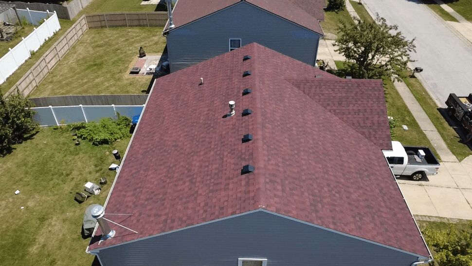 Top view of roof center ridge with a row of ventilation caps