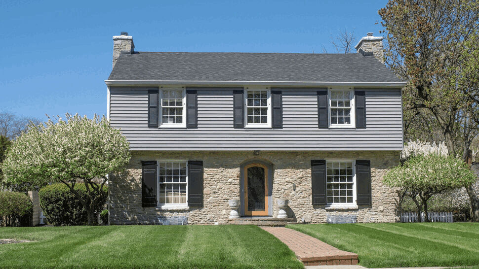 Two-level home after an exterior remodeling project.