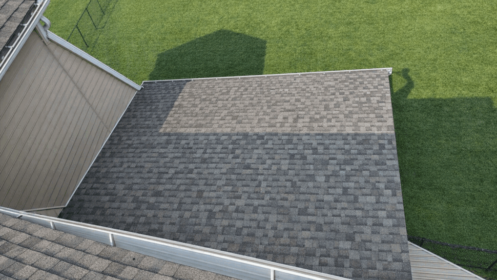 Lower roof section with visible gutter and shingle pattern from above