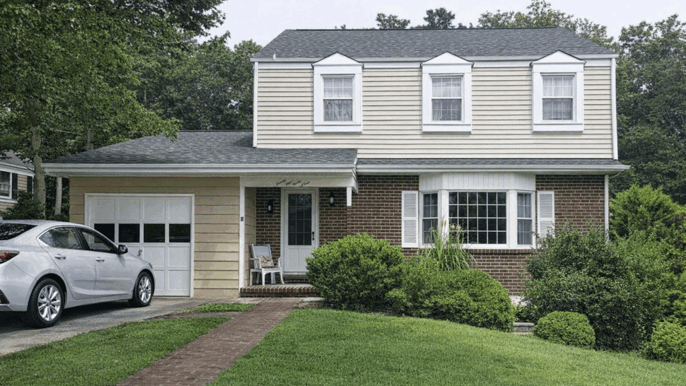 Front two-story home with new roof | Tycos Roofing And Siding Inc Front view of two-story house with new shingle roof, brick and siding