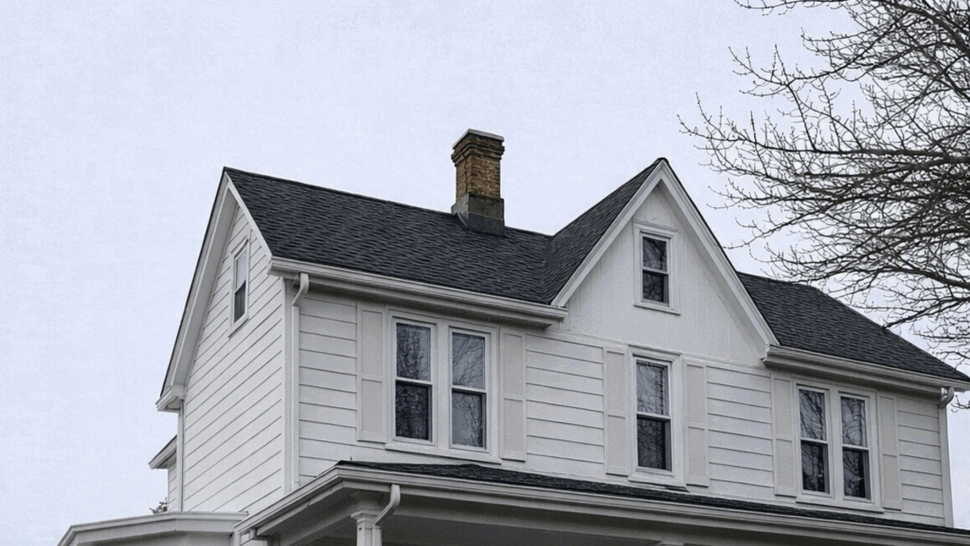 Front Porch Siding and Gutters | Tycos Roofing And Siding Inc Front porch of a white two-story house with shutters and a covered entry.