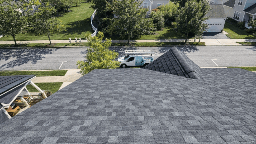 Close-up of shingle roof surface | Tycos Roofing And Siding Inc Close aerial shot of textured asphalt shingles on a roof