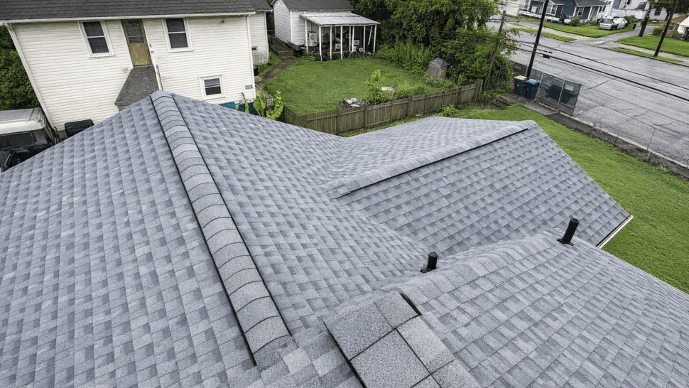 New Gray Shingle Roof | Tycos Roofing And Siding Inc Close aerial view of a newly installed gray asphalt shingle roof.