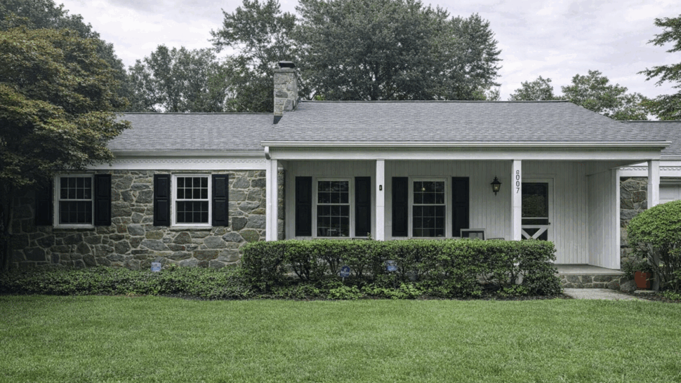 Stone Front Porch with New Roof | Tycos Roofing And Siding Inc Single-story stone house with covered porch and grey shingle roof