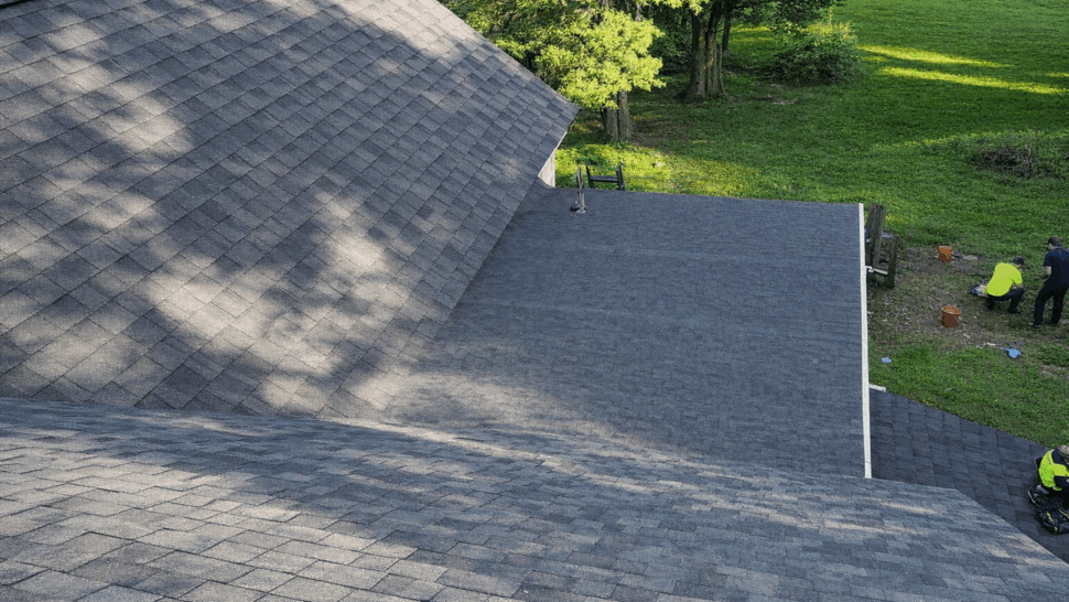 Gray Shingle Roofing Installation | Tycos Roofing And Siding Inc Close-up of a newly installed gray asphalt shingle roof in sunlight.
