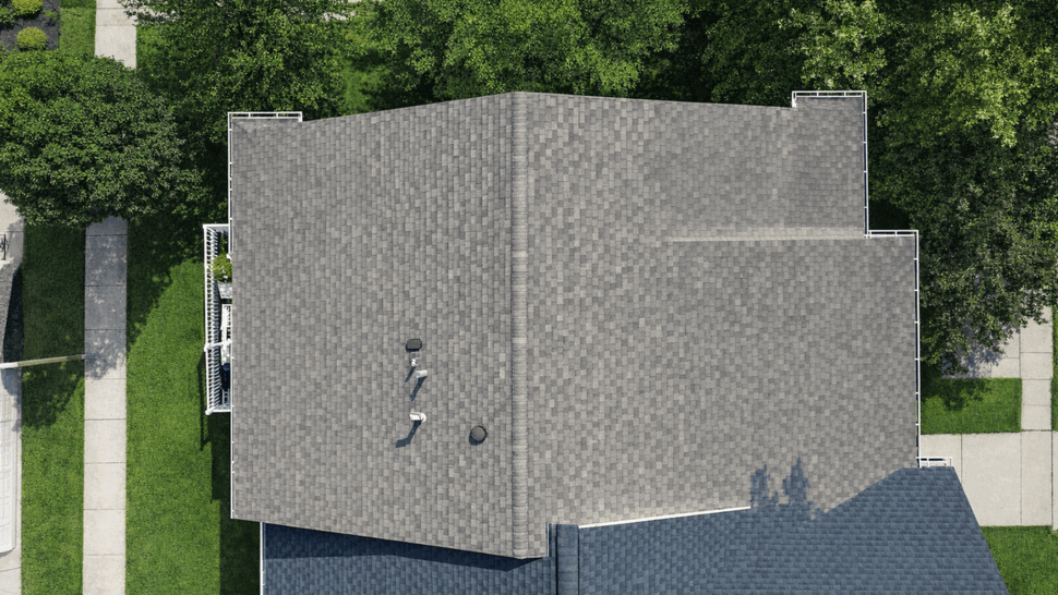 Top-down Residential Roof View | Tycos Roofing And Siding Inc Top-down drone view of a residential shingle roof with vents and gutters