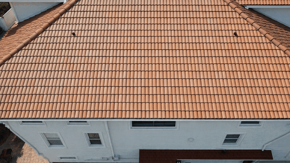 Close-up Terracotta Roof Tile Detail | Tycos Roofing And Siding Inc Close-up top-down view of terracotta roof tiles laid in neat rows
