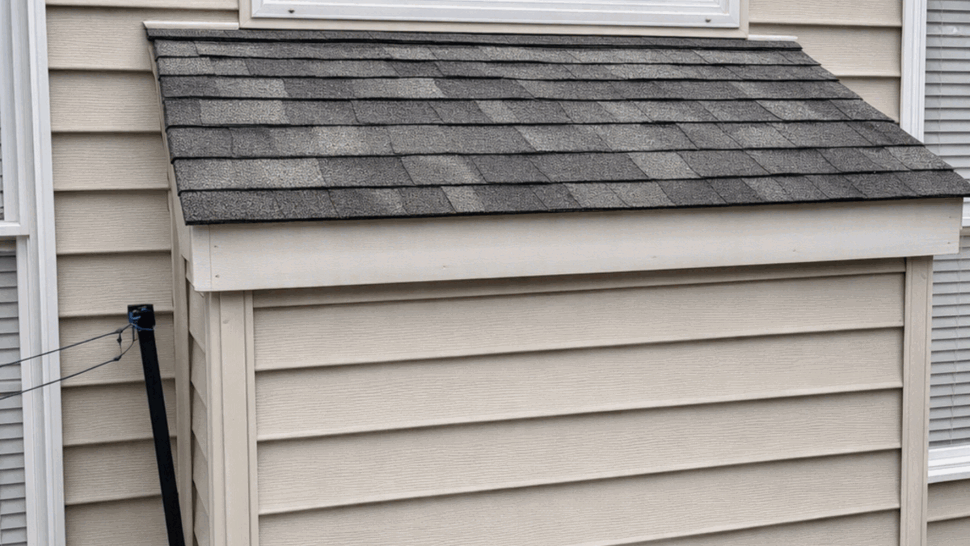 Deck Enclosure with Shingle Roof | Tycos Roofing And Siding Inc Small deck enclosure under a window with shingle roof and vinyl siding