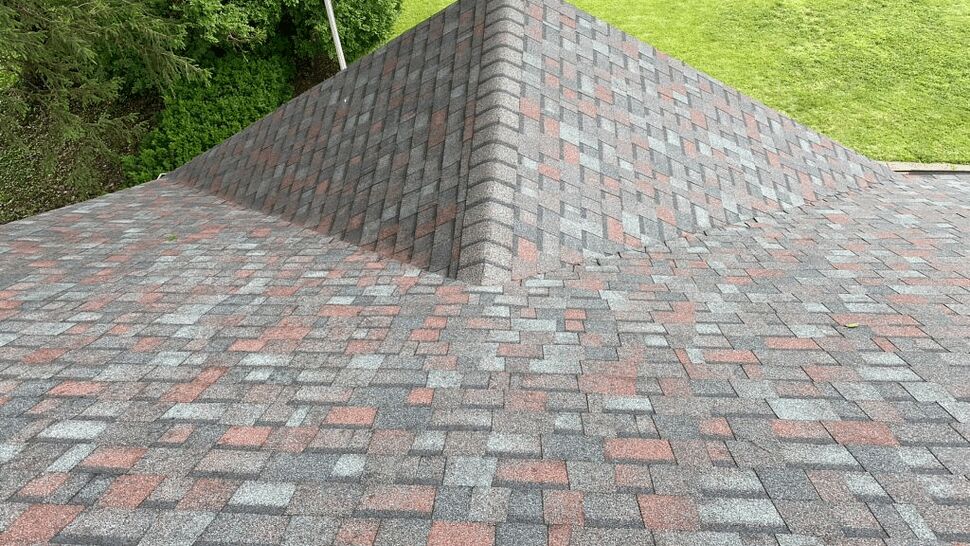 Close-up asphalt shingle hip and ridge detail on residential roof
