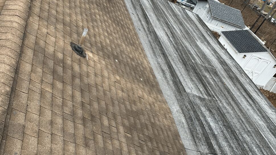 Close aerial view of brown shingles beside a weathered membrane roof section