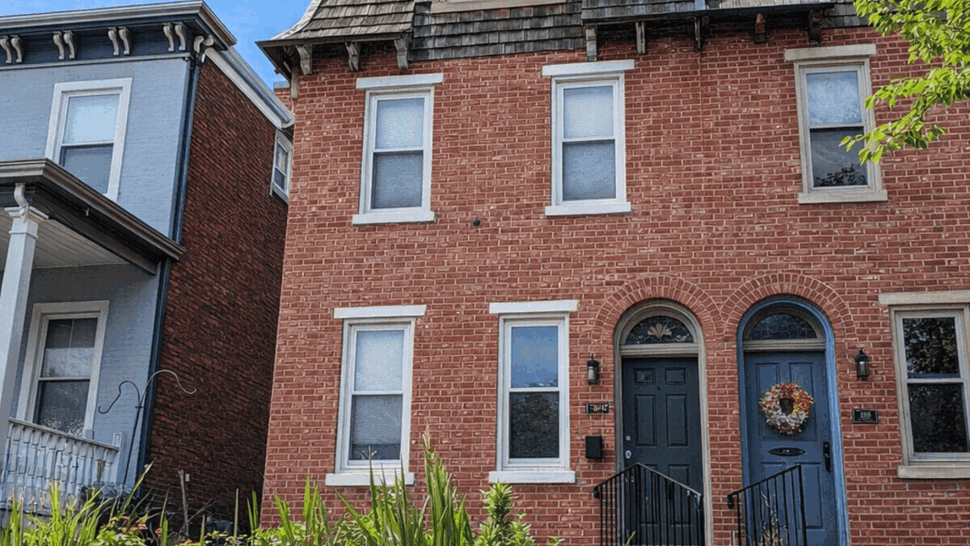 Brick Townhouse with Mansard Roof | Tycos Roofing And Siding Inc Brick townhouse with mansard wood-shingle roof and front entry doors