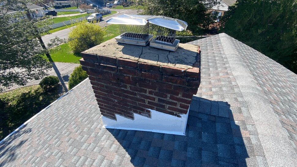 Chimney Flashing and Shingle Repair | Tycos Roofing And Siding Inc Brick chimney with new flashing and surrounding asphalt shingles
