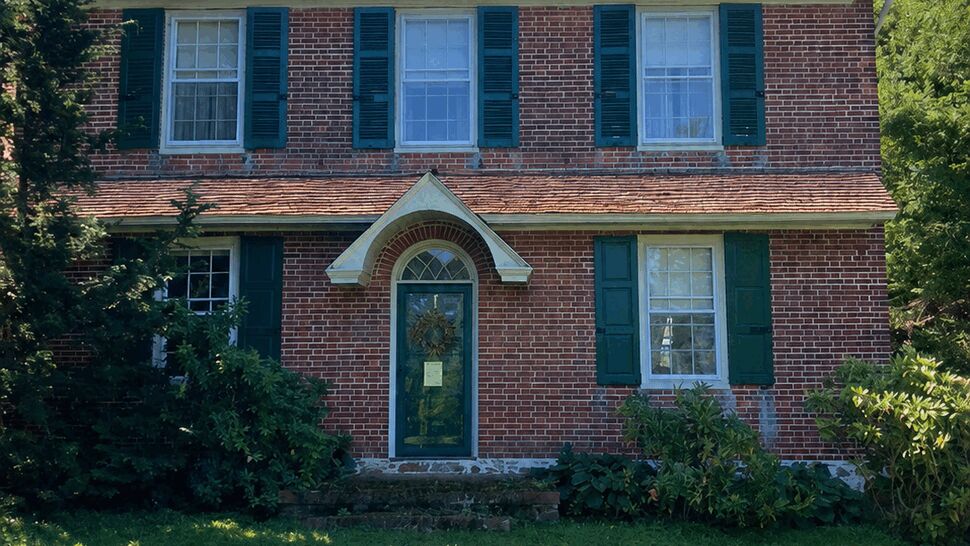 Colonial Front Cedar Roof | Tycos Roofing And Siding Inc Front view of colonial brick house with cedar shake roof and green shutters