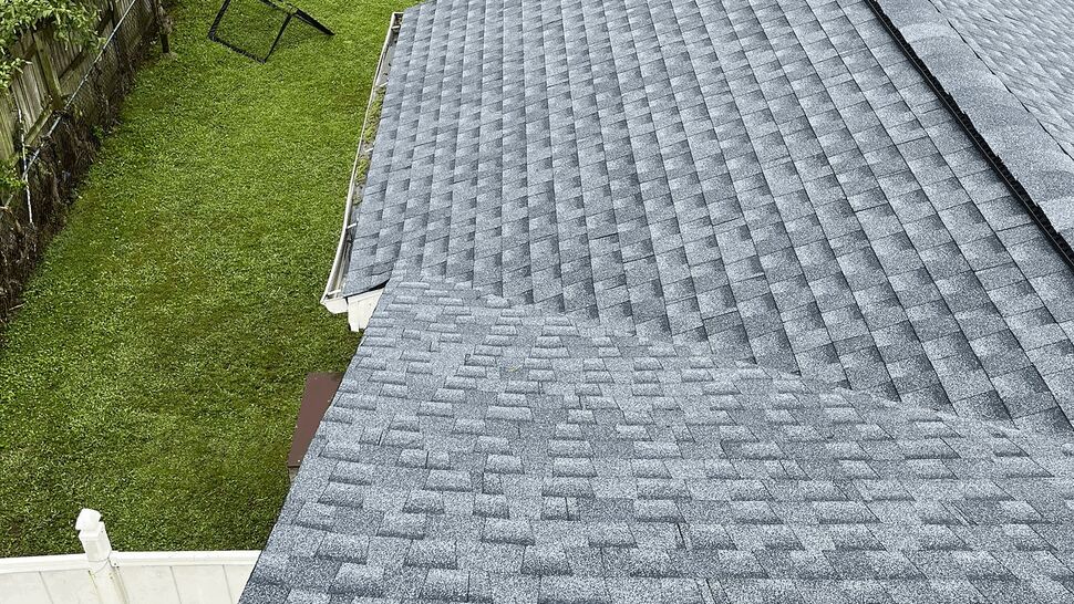 Completed Gray Roof Detail | Tycos Roofing And Siding Inc Detailed aerial view of gray shingles across a residential roof edge.