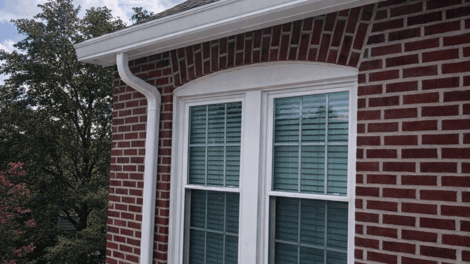 Shingle Roof and Chimney Service | Tycos Roofing And Siding Inc Shingle roof and brick chimney with white gutter and downspout