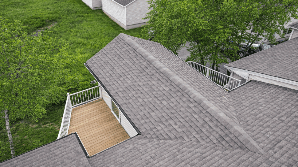 Roof area with a recessed balcony cutout and surrounding shingles