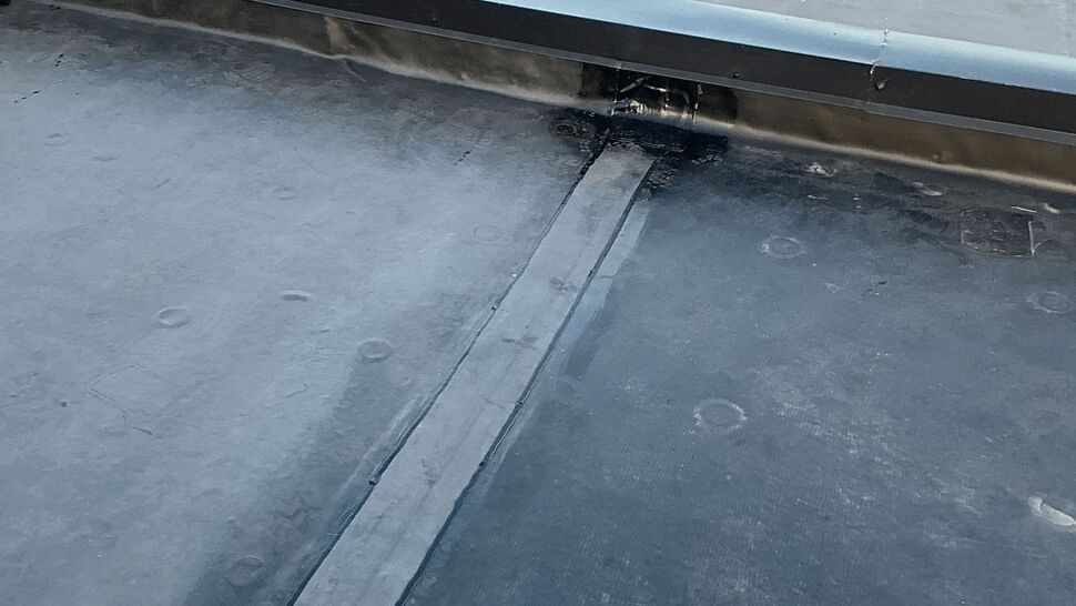 Detail of flat roof seam and membrane patching