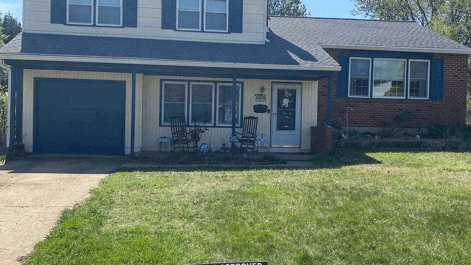 Residential Roof and Windows | Tycos Roofing And Siding Inc Front view of a two-story home with gray roofing, windows, and blue shutters.