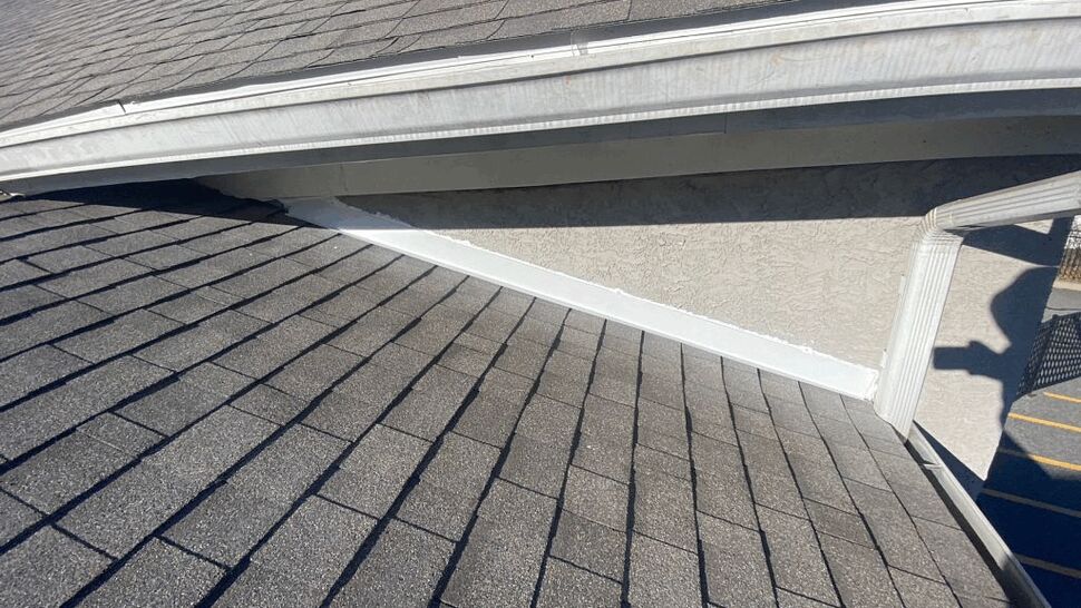 Gutter, flashing and roof valley with shingles