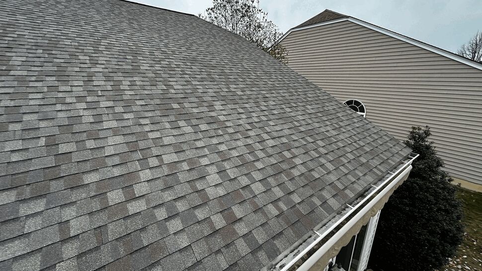 Roof slope meeting a gutter along the eave edge