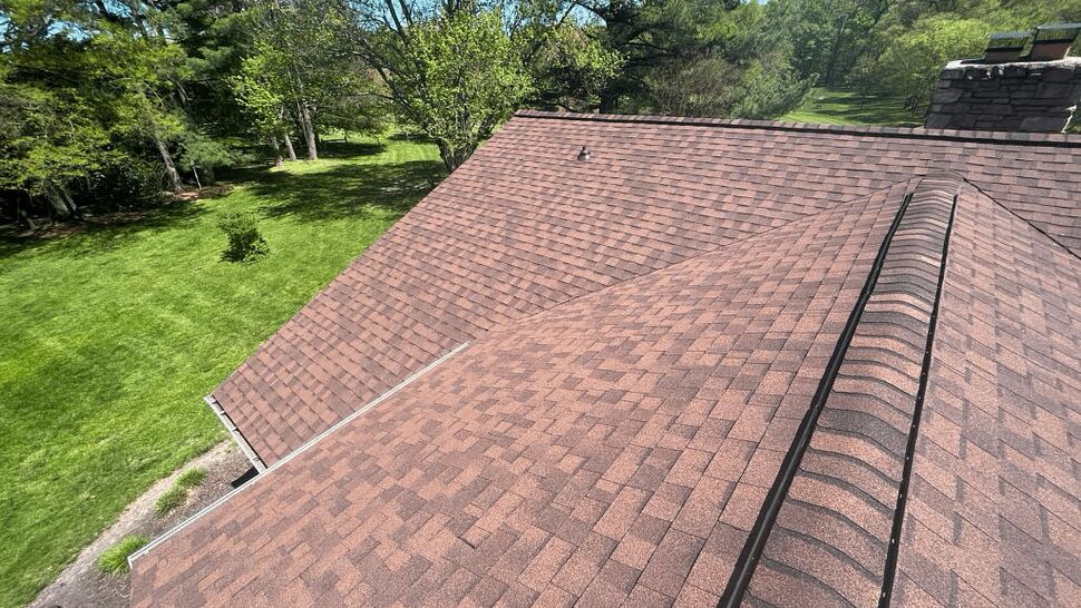 Close-up of roof shingles and ridge vent on a residential roof