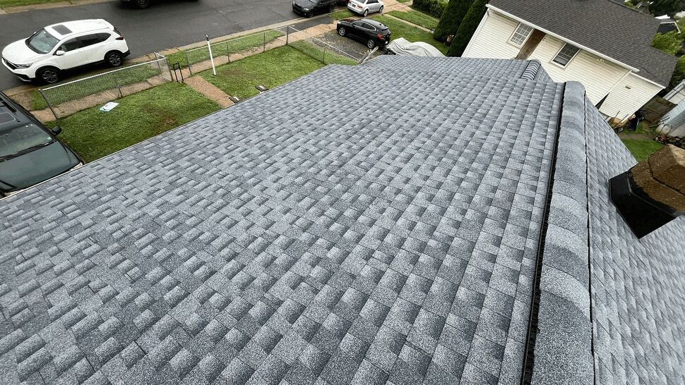 Gray Architectural Shingle Roof | Tycos Roofing And Siding Inc Aerial view of gray architectural shingles covering a residential roof.