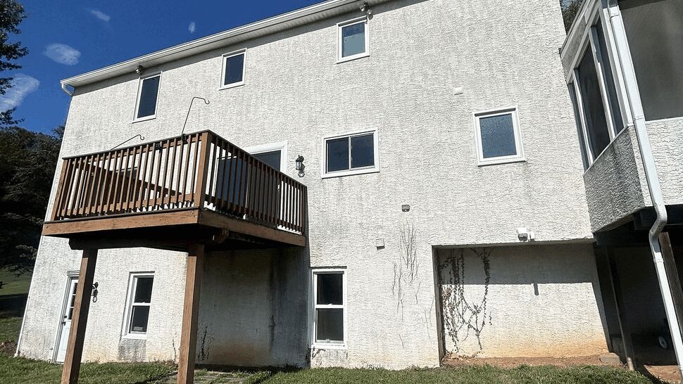 Small wooden balcony exterior | Tycos Roofing And Siding Inc Small wooden balcony over basement on rear of house