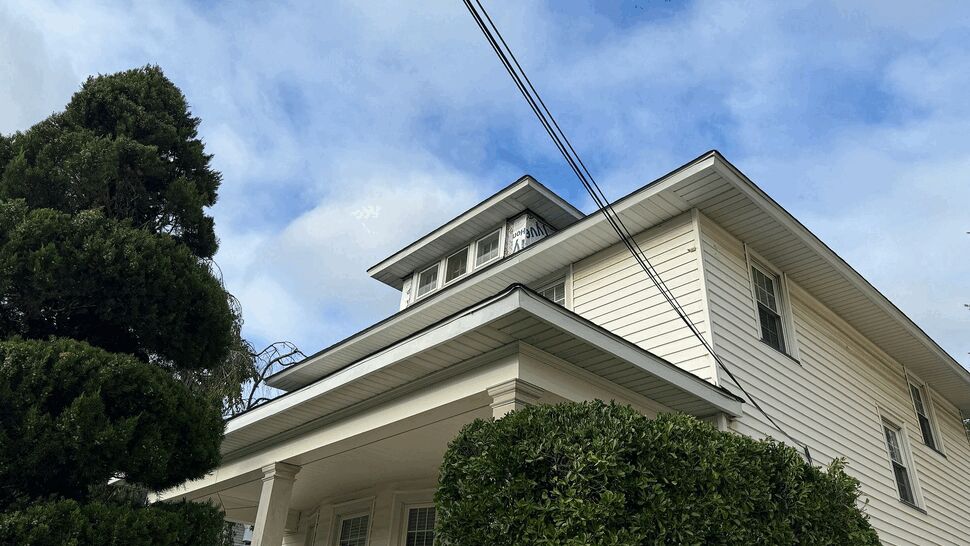 White House Exterior Siding | Tycos Roofing And Siding Inc Close view of a white home with horizontal siding and covered porch