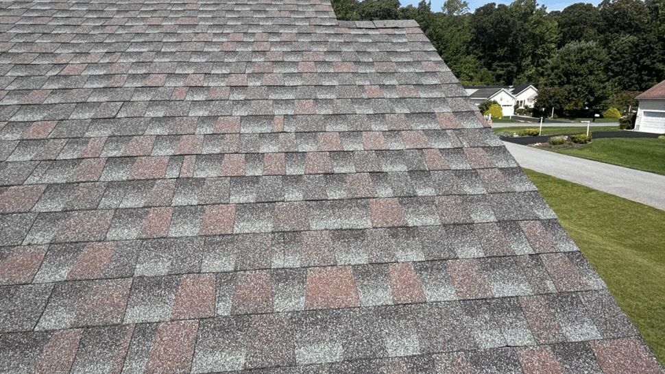 Multicolor Asphalt Shingle Roof | Top Roofing & Siding Multicolor asphalt shingle roof overlooking a quiet residential neighborhood