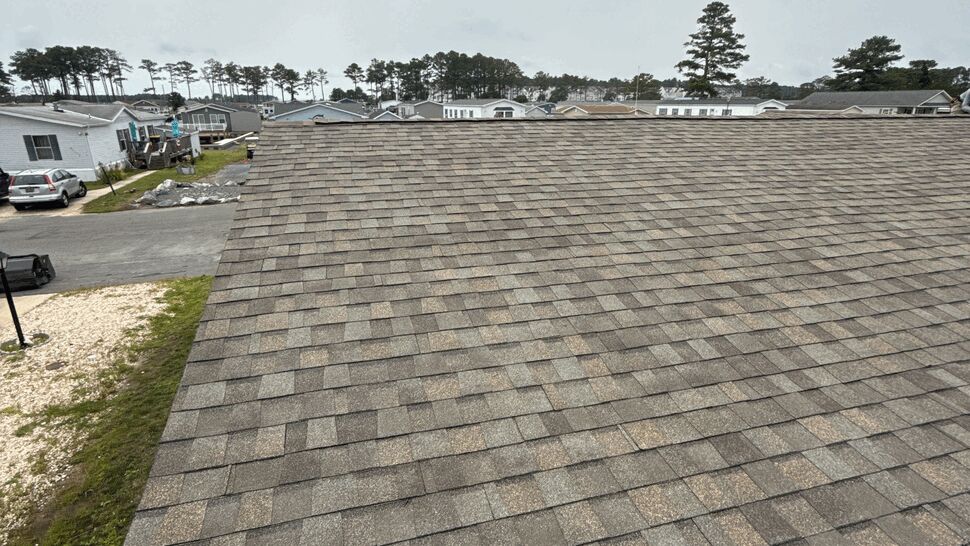 Residential Shingle Roof | Top Roofing & Siding Gray shingle roof viewed across a manufactured home community